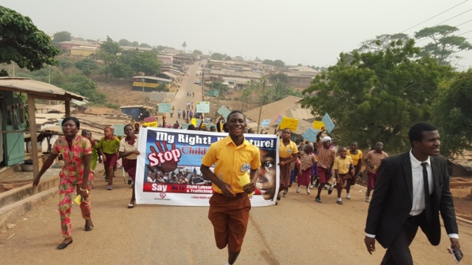 Children Float and parade through streets advocating against child trafficking